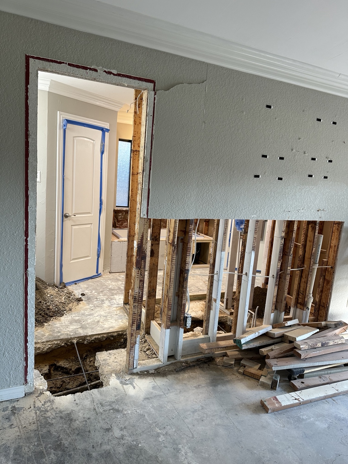 Selective interior demolition with wall framing exposed during renovation