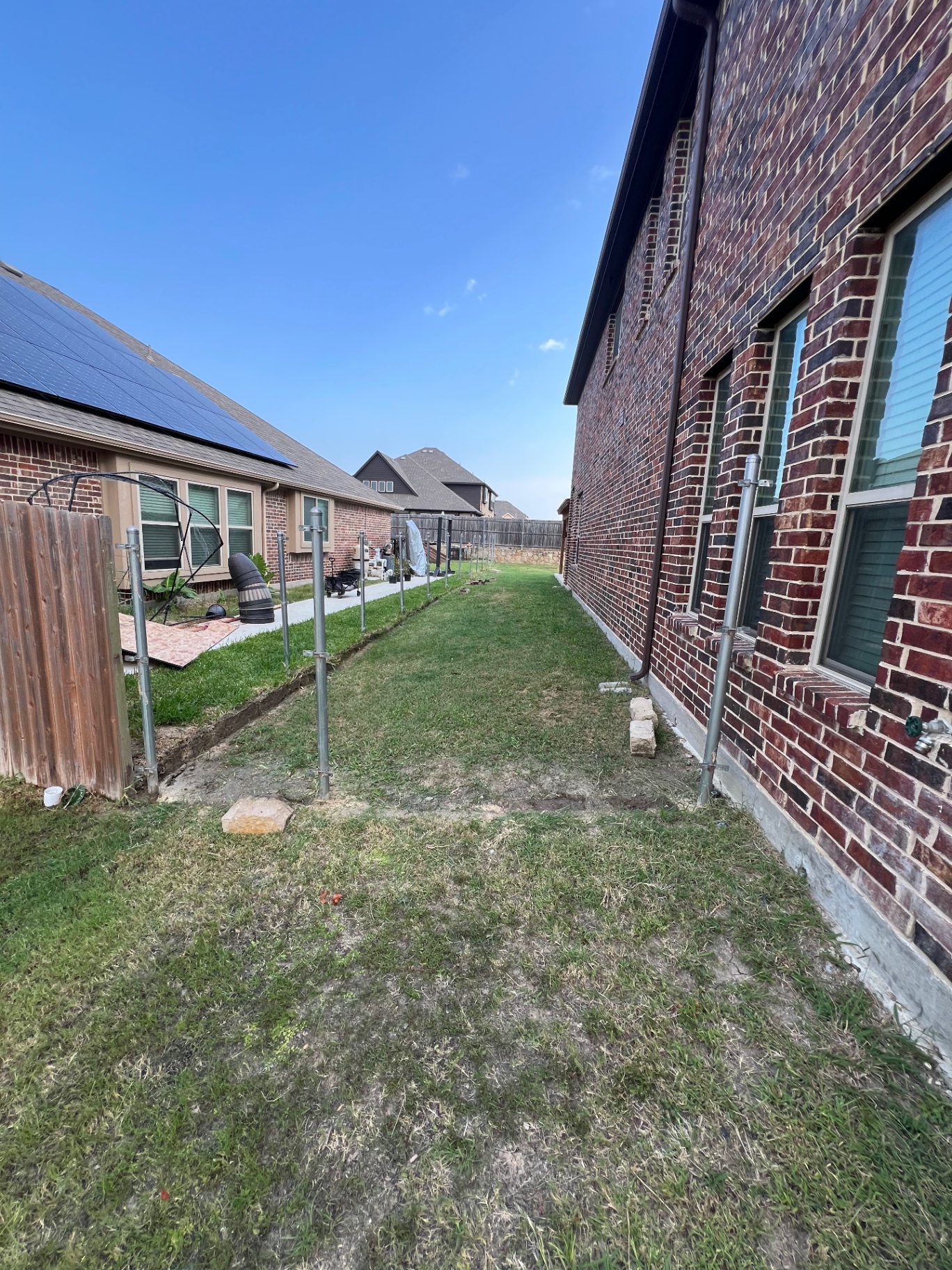 Forney side yard cleared after wood fence removal with fence panels and debris hauled away