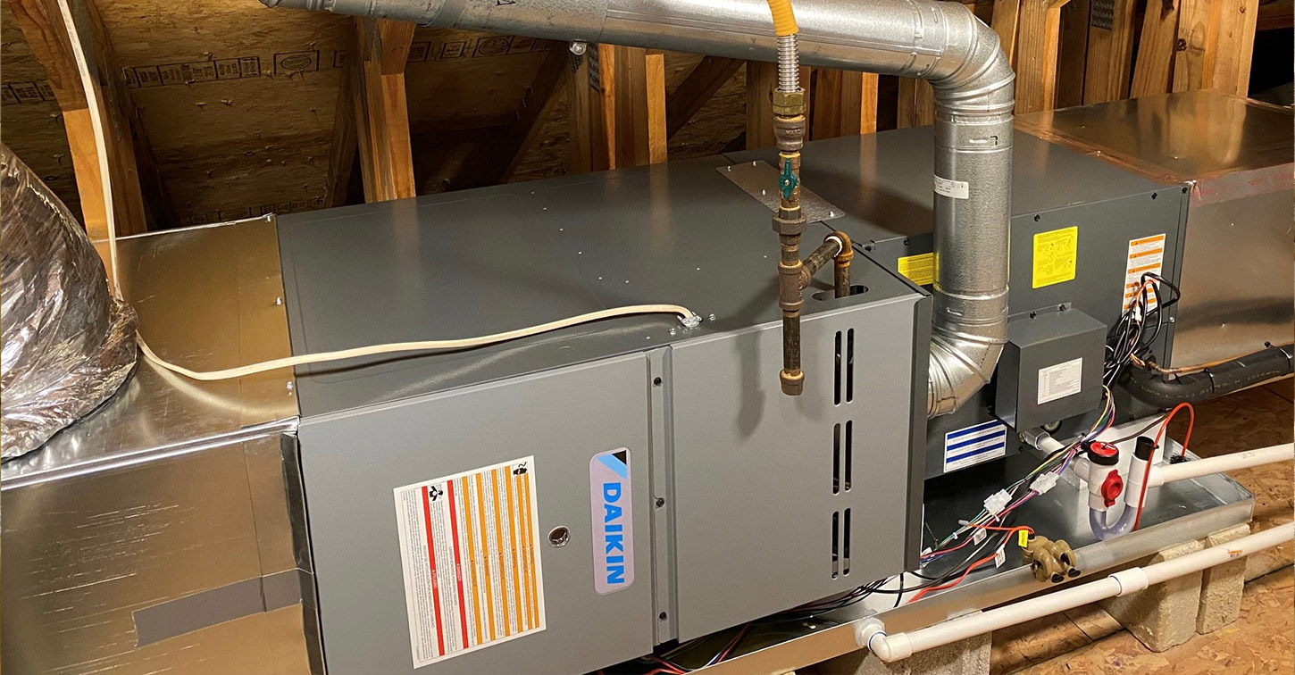 Daikin air handler and heating system installed in an attic before removal