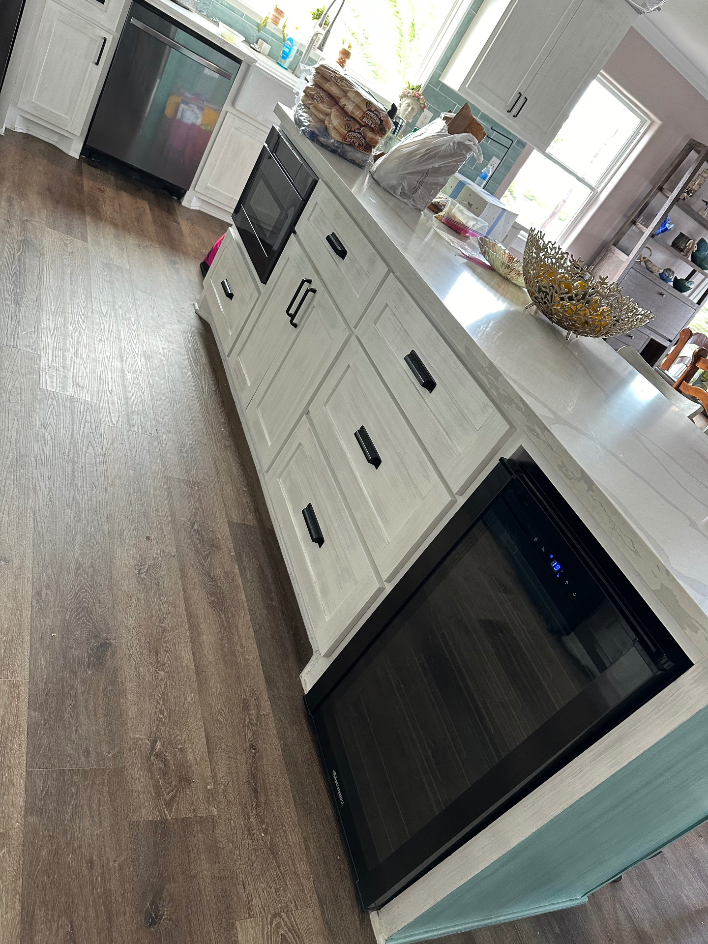 Built-in wine refrigerator installed inside kitchen cabinetry