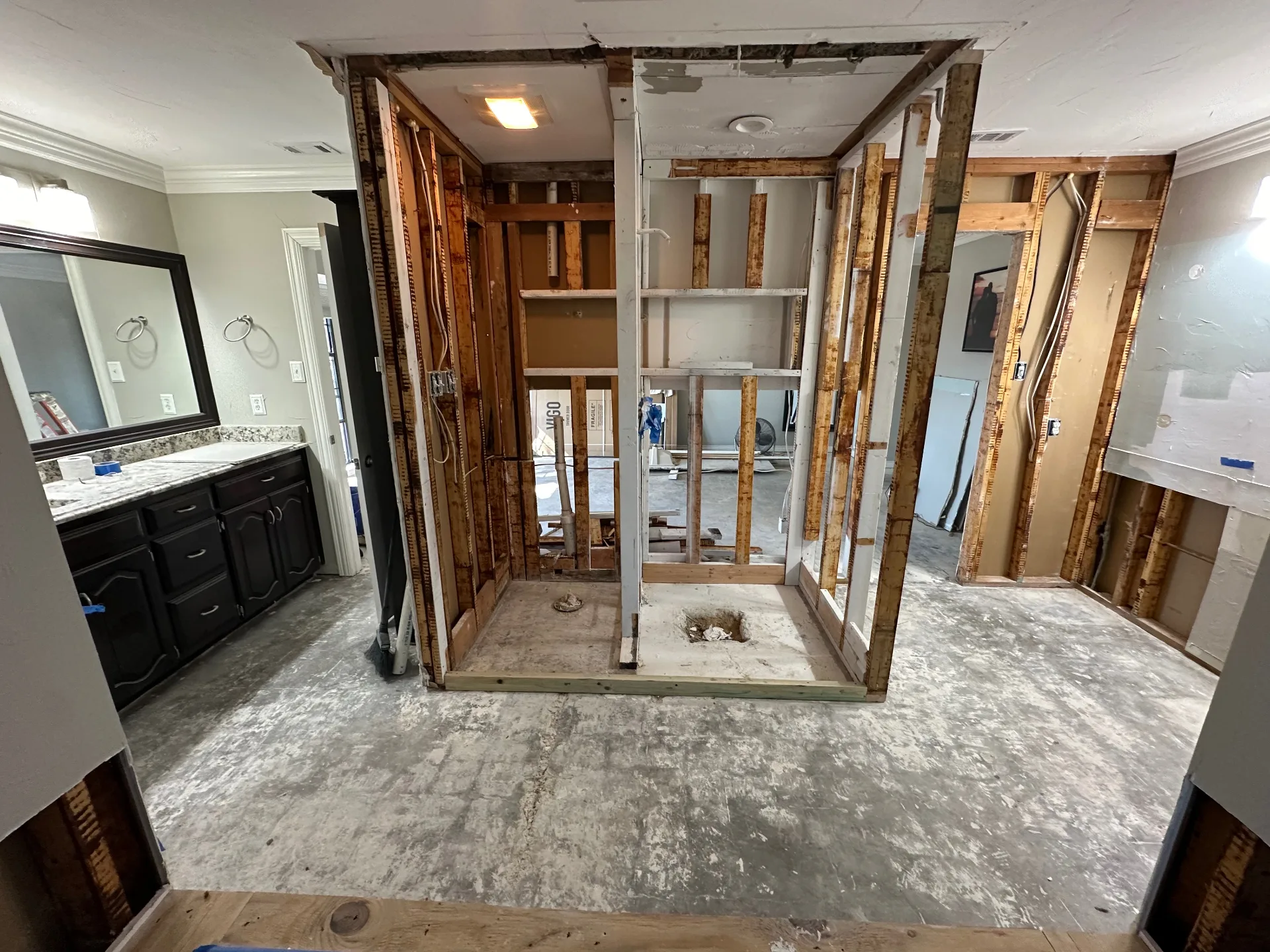 Master bathroom fully gutted to the studs after water damage demolition