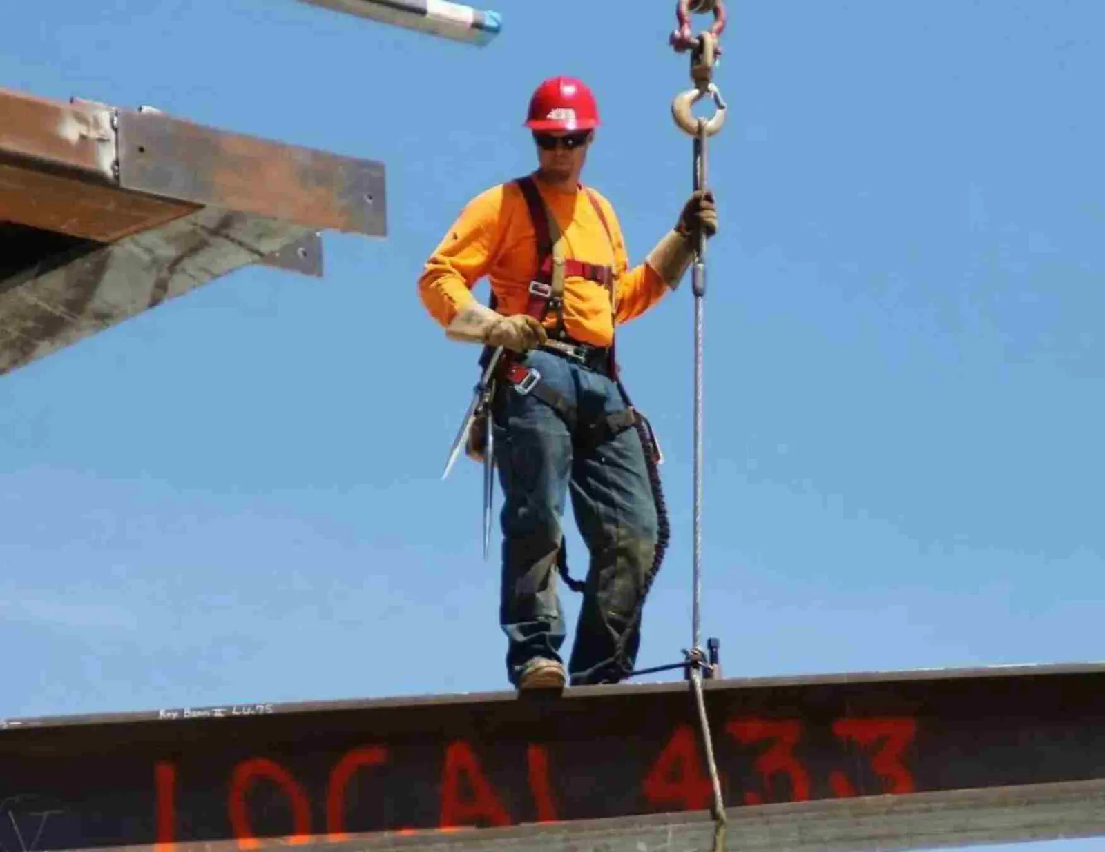 Paul working high on a steel beam as a Local 433 union ironworker