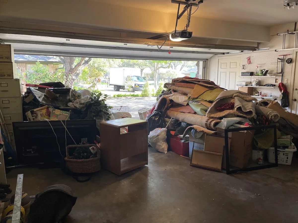 Before photo of garage cleanout posted by Audrey Bates in a Google review of Kick It Junk Removal