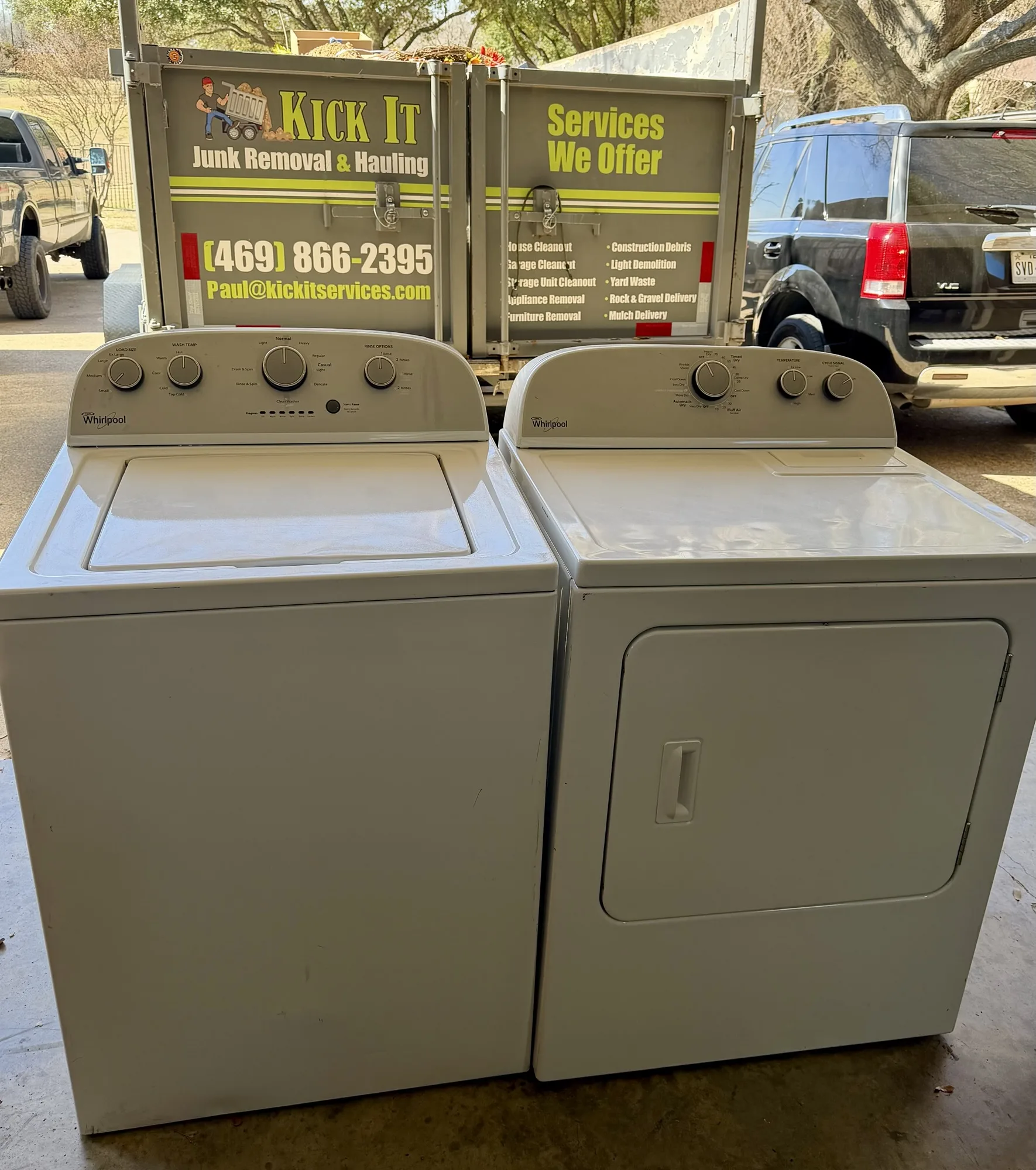 Washer and dryer removed during an eviction cleanout, in front of the Kick It trailer
