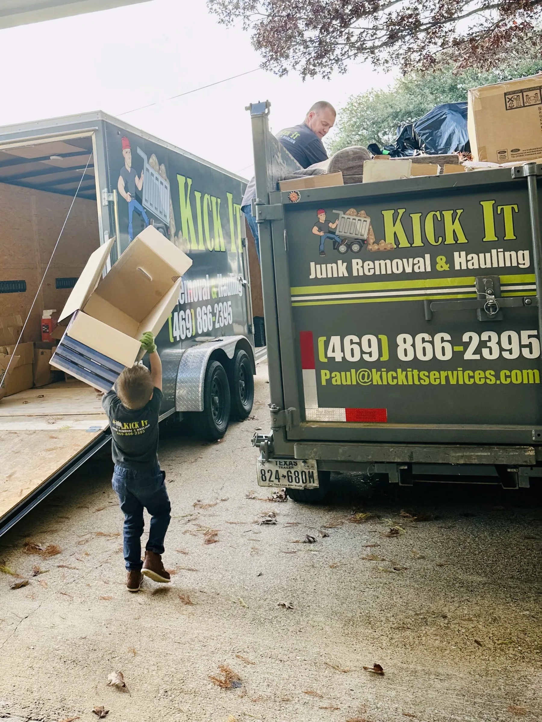 Kick It crew loading boxes into the trailer for a pre-listing cleanout