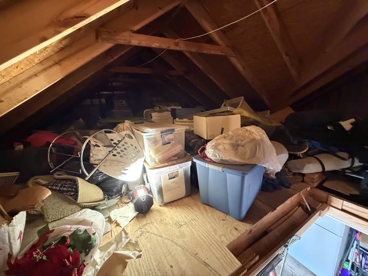 Before photo of attic cleanout posted by Becky Sheppard in a Google review of Kick It Junk Removal