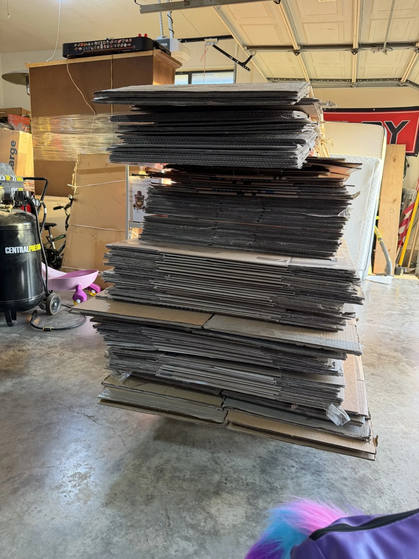 Cardboard boxes loaded on the Kick It trailer for recycling