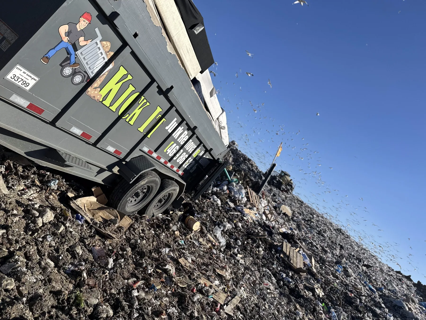 Kick It truck and trailer at a commercial cleanout job in Forney, TX