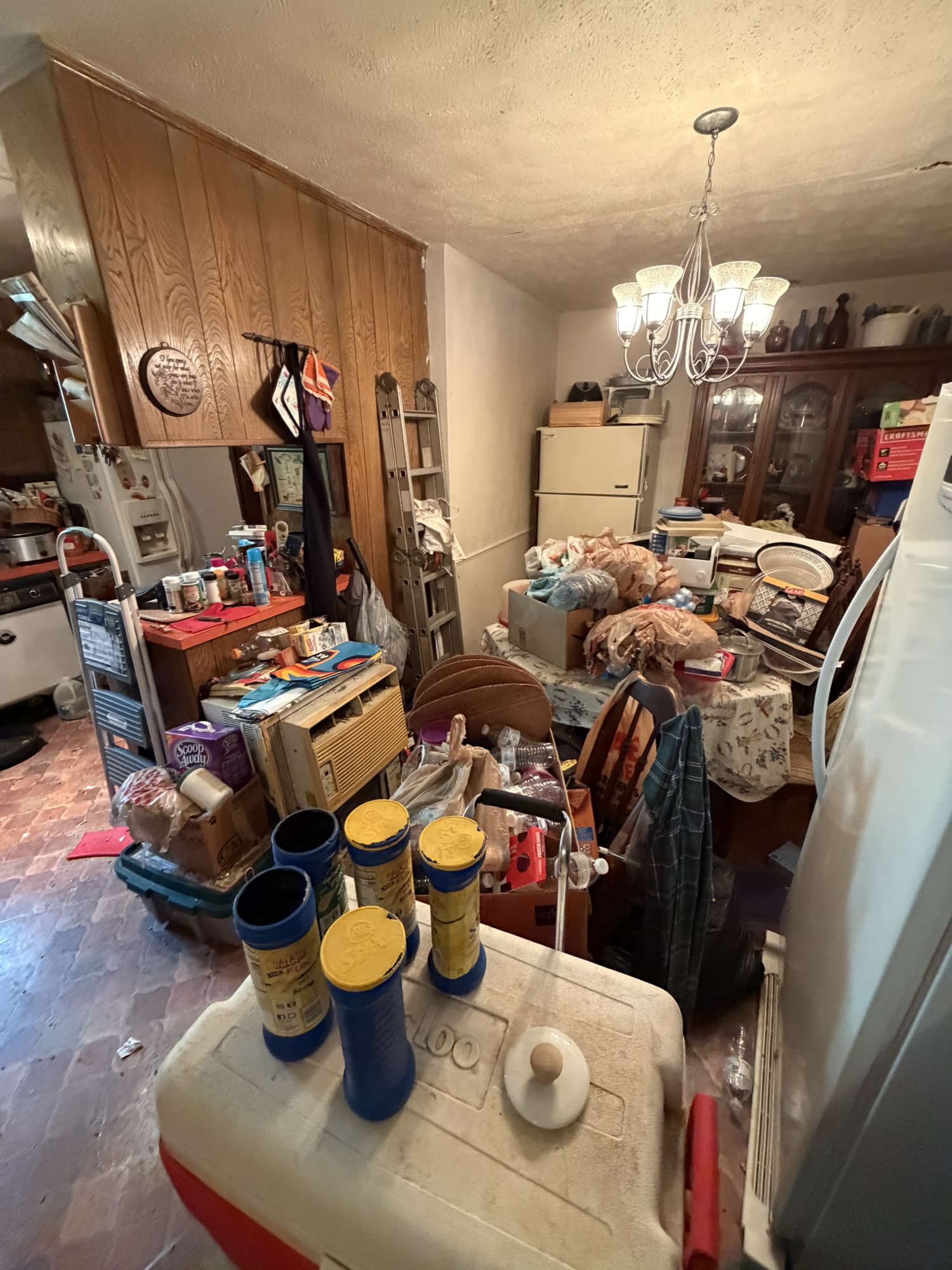 Cluttered kitchen during whole-home cleanout