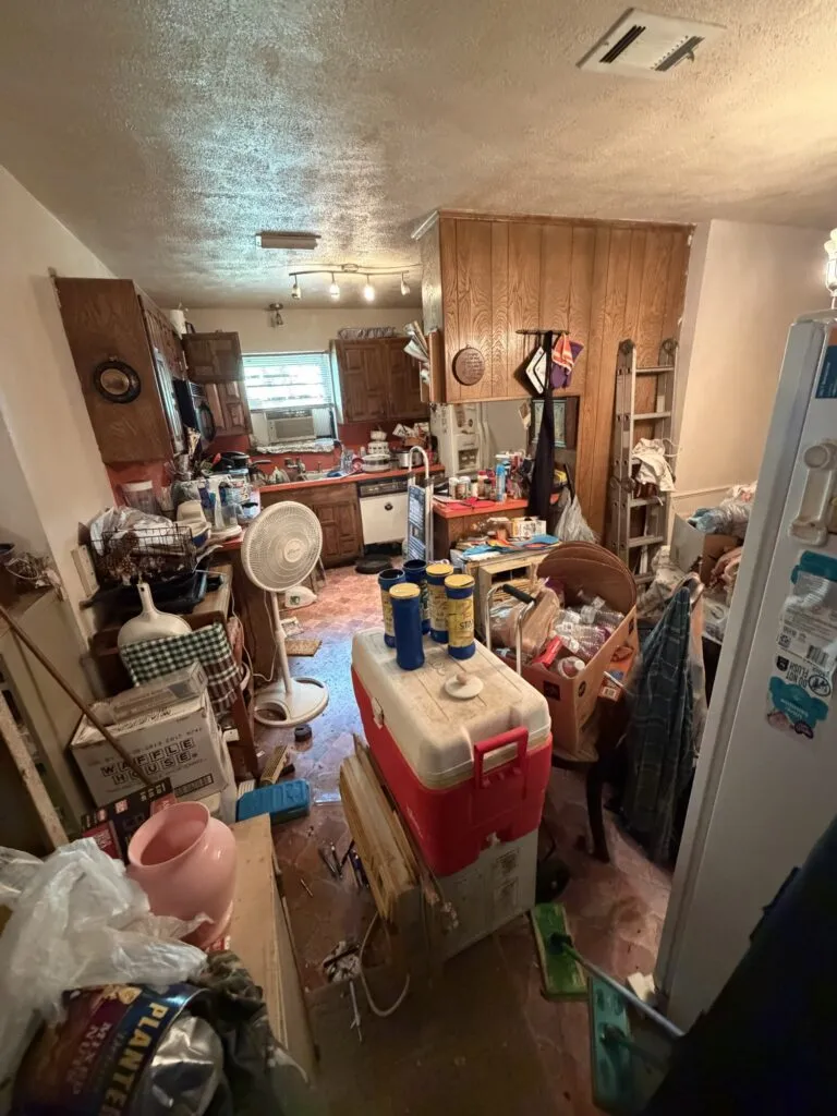 Kick It crew clearing a heavily cluttered room in North Texas