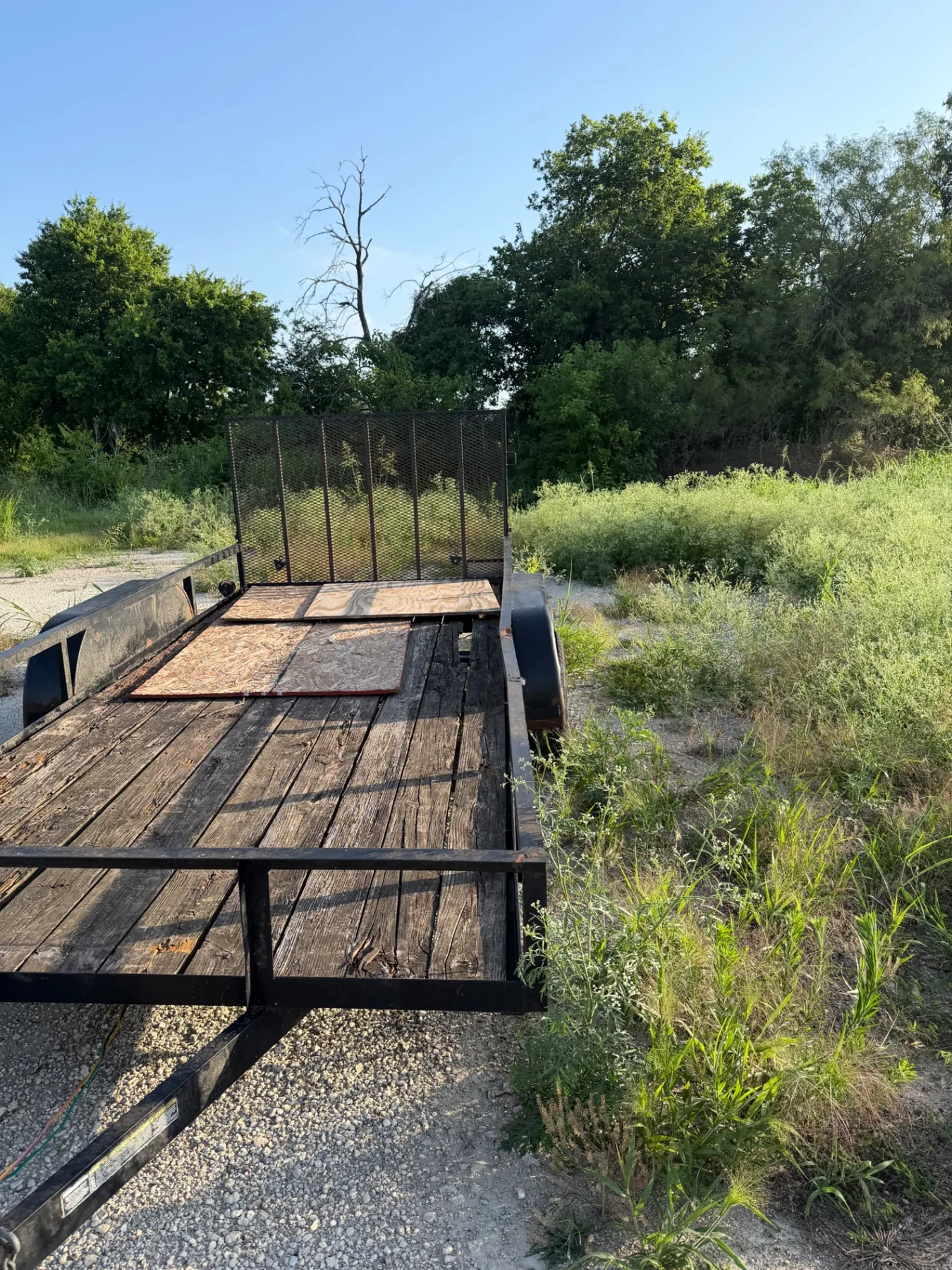 Flatbed trailer before repairs and rebuild at Kick It Junk Removal in Forney TX