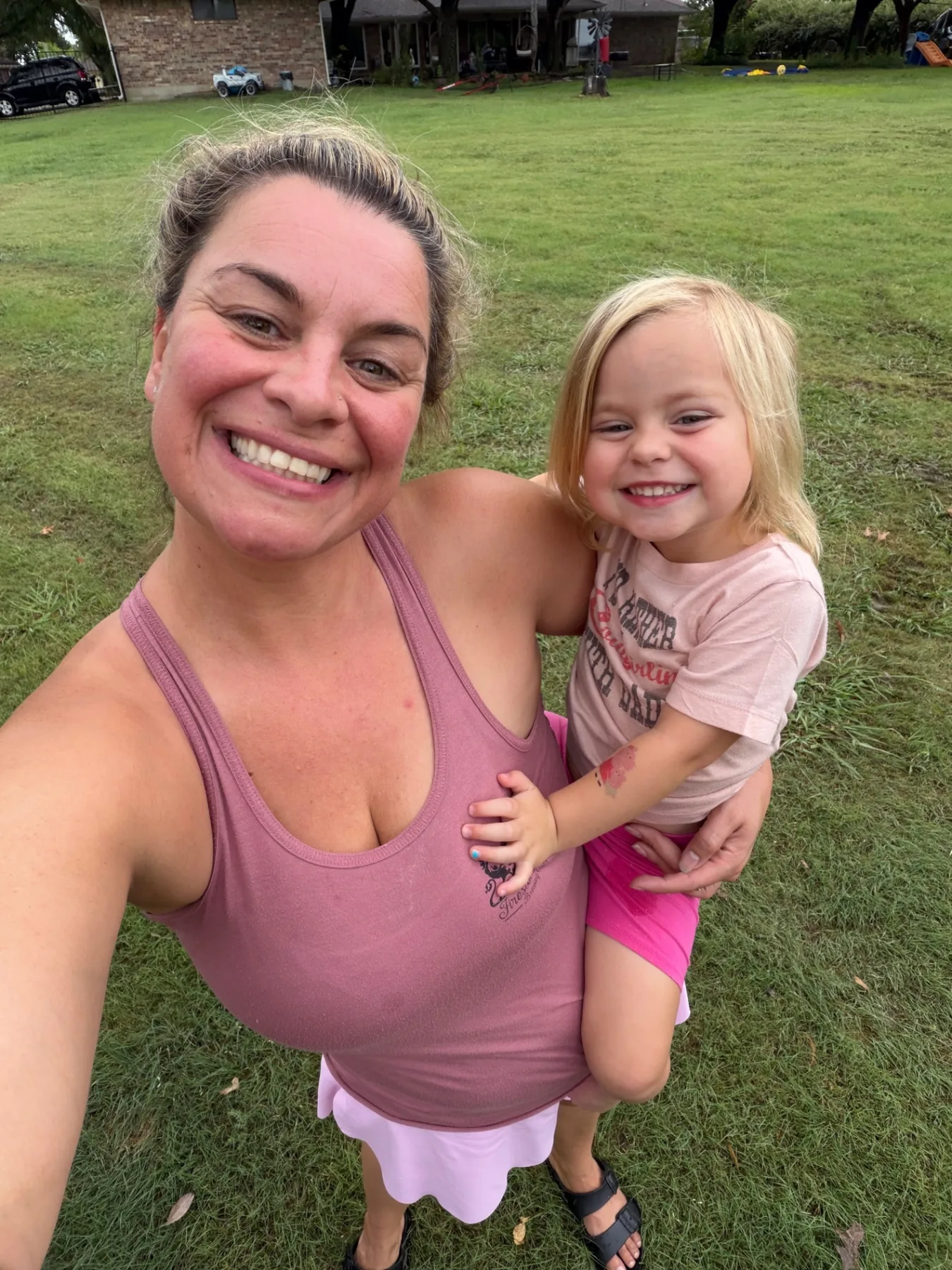 Mom and daughter smiling together after a day with the Kick It Junk Removal family business