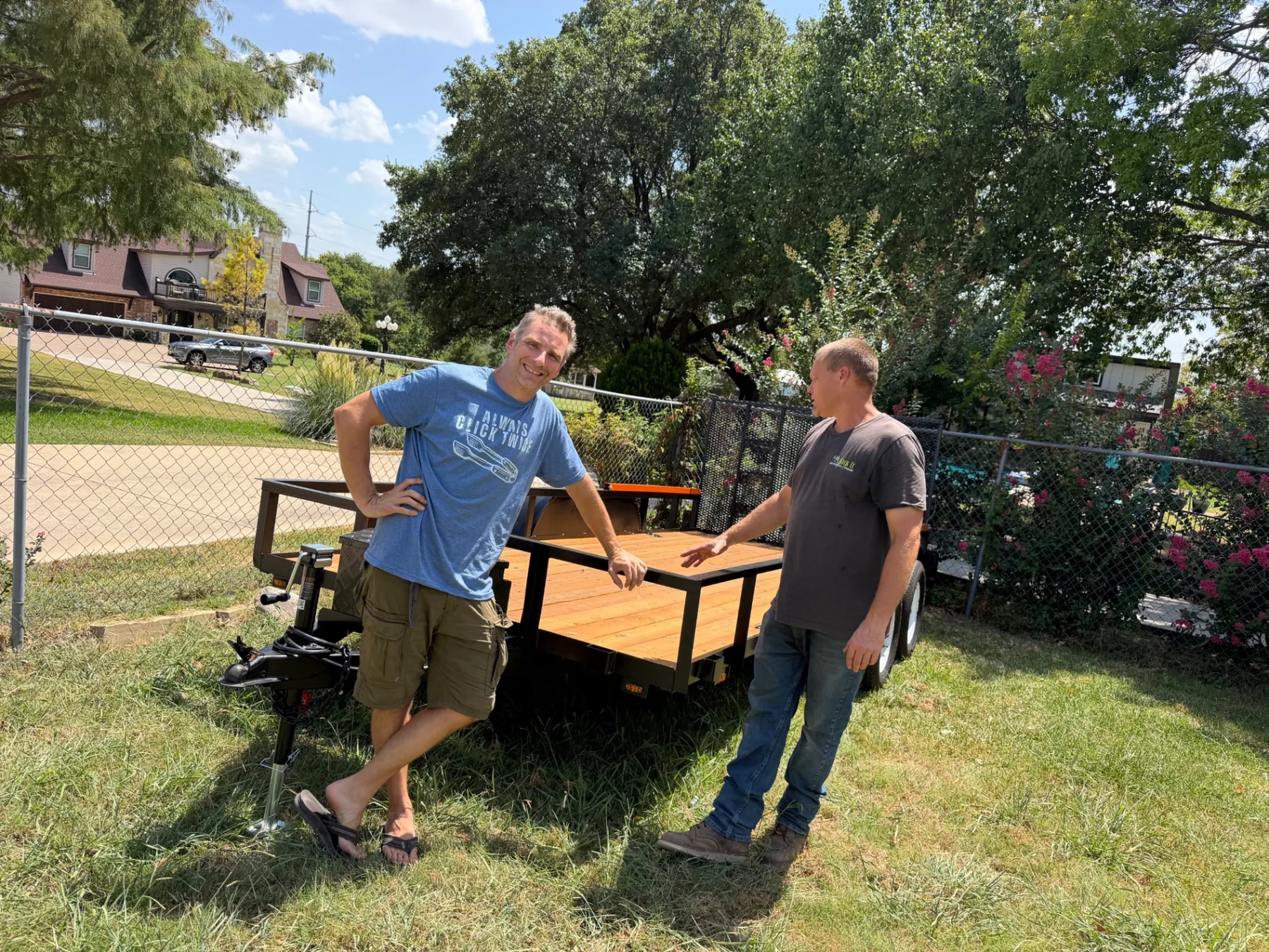 Paul and a friend admiring the rebuilt Kick It flatbed trailer
