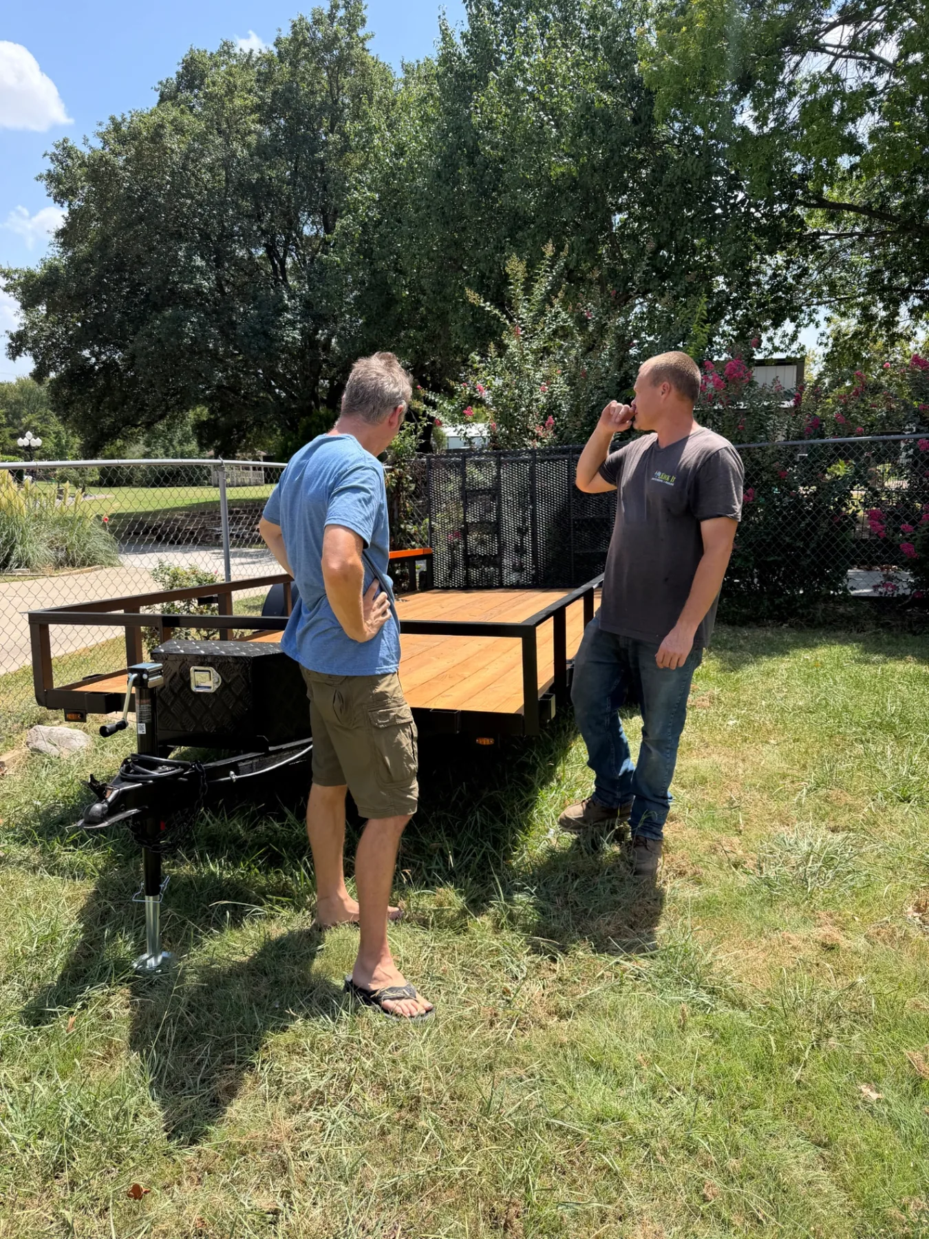 Paul and a friend looking over the finished flatbed trailer