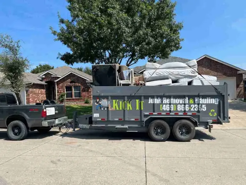 Kick It trailer loaded with furniture and mattresses at a Forney home