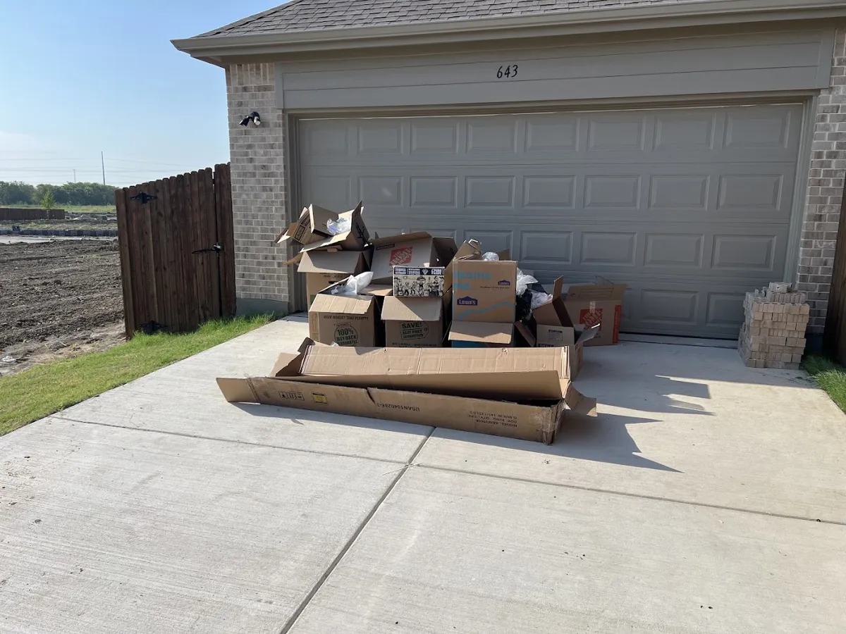 Before photo of moving boxes pickup posted by Matt Menzer in a Google review of Kick It Junk Removal