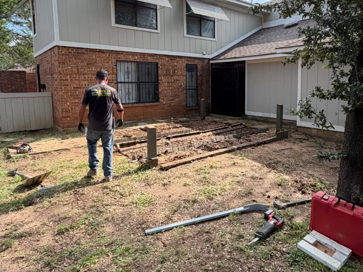 Kick It crew member working during a pergola removal in Dallas
