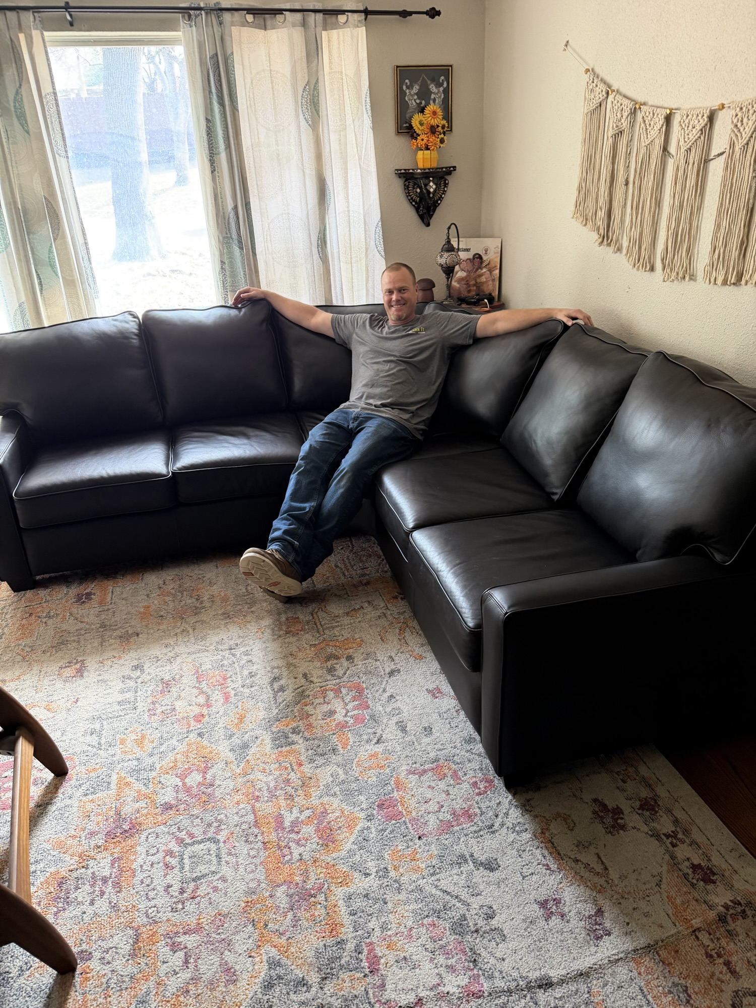 Kick It crew member sitting on a sectional couch before removal