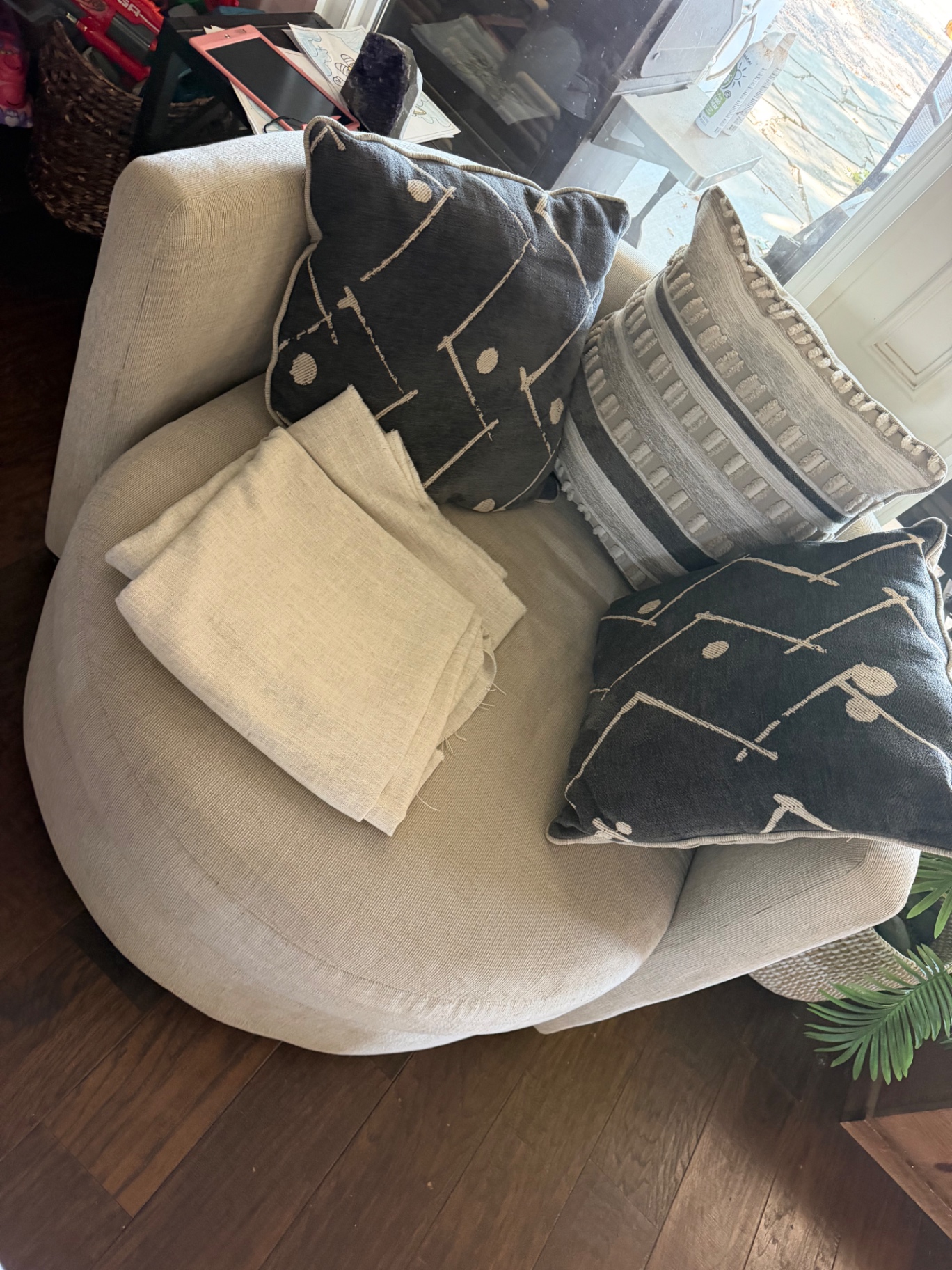 Oversized round upholstered chair before removal
