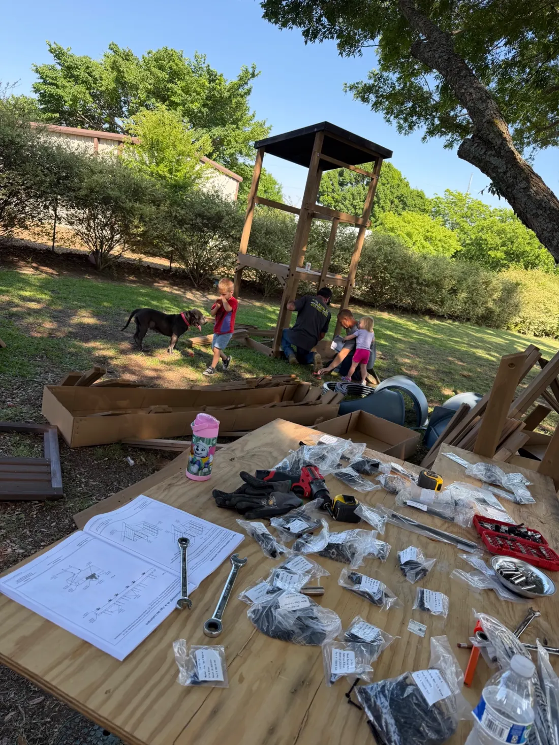 Playset parts, hardware, and instructions laid out at the start of the build