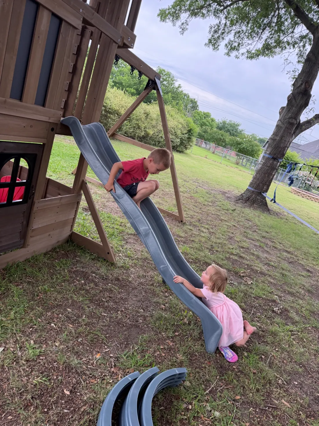 The Kick It kids enjoying their new playset