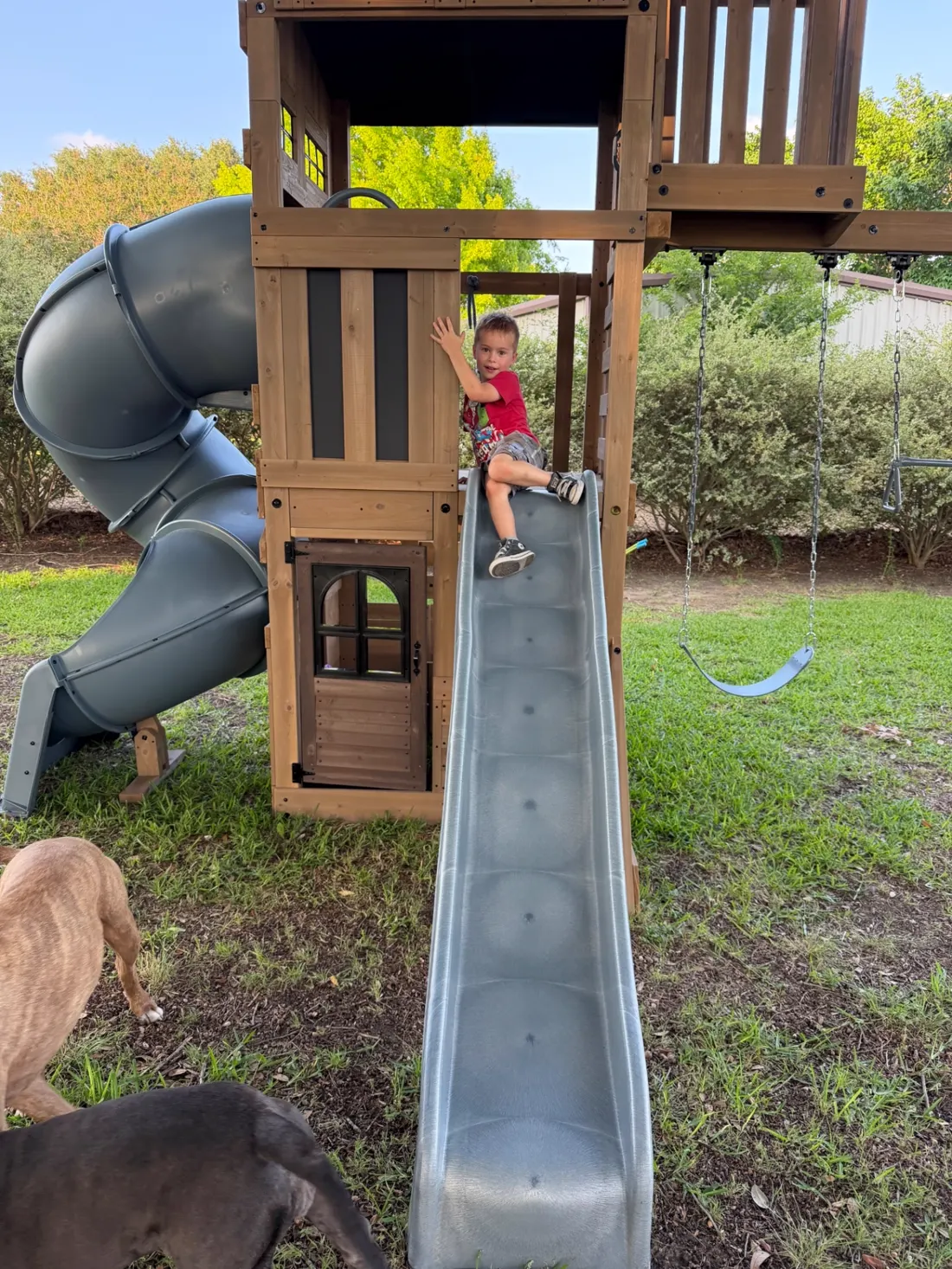 The Kick It boy, often seen on job sites helping Dad, enjoying his new slide